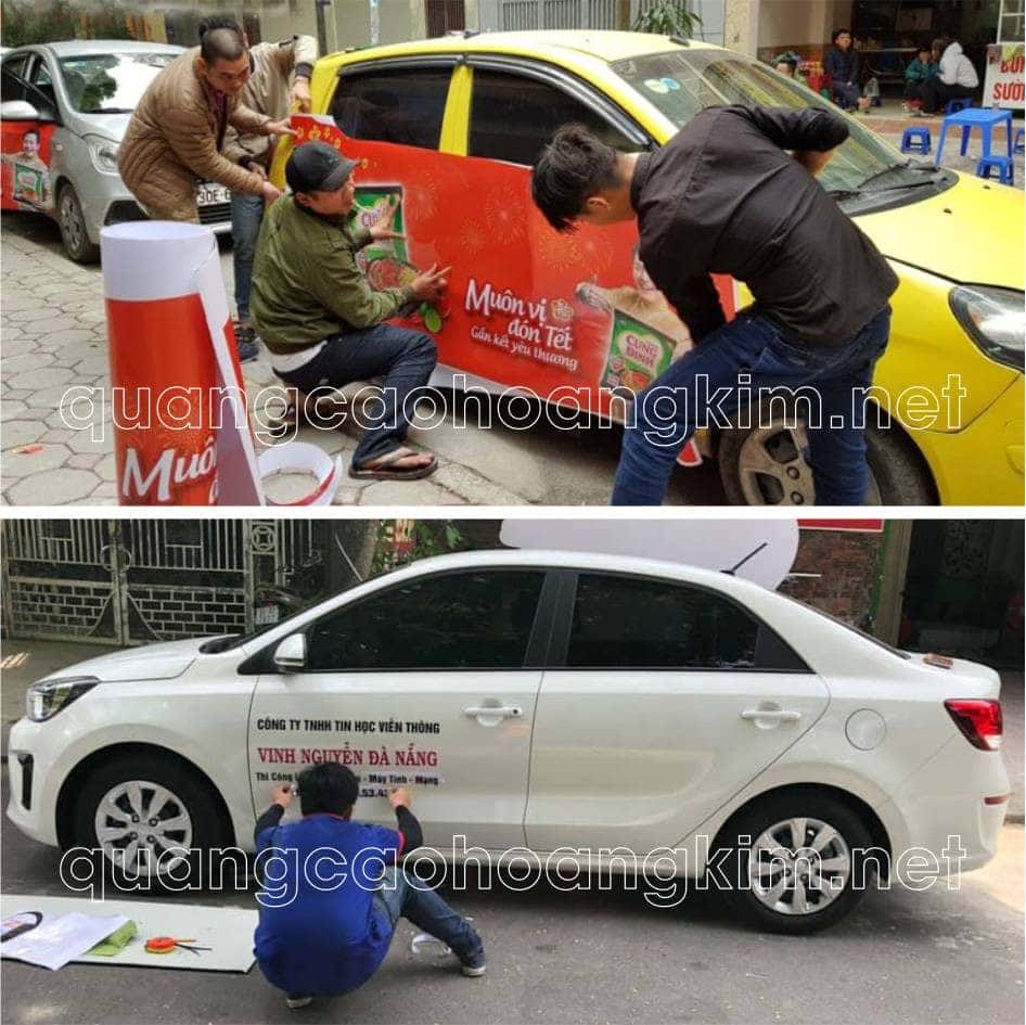 Thợ chuyên nghiệp dán đề can quảng cáo trên xe hơi